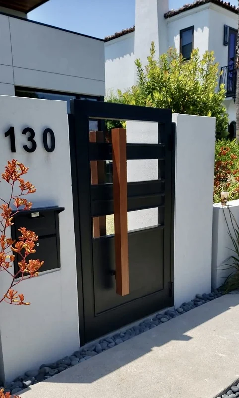 Custom iron entry door with detailed scrollwork